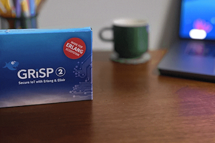 GIF showing the unboxing of the GRiSP 2 board from its packaging, highlighting the hardware design for IoT development.